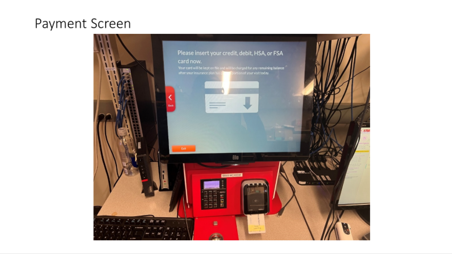 Photo of the legacy kiosk hardware displaying a payment screen at check-in.